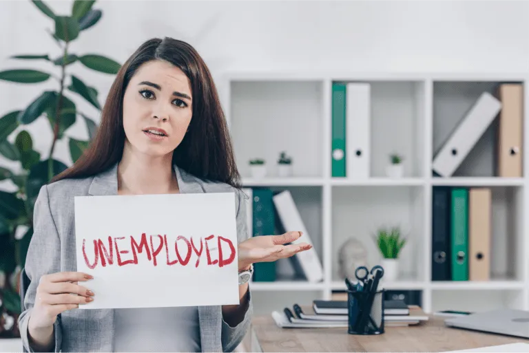 worried employee showing placard with unemployed word