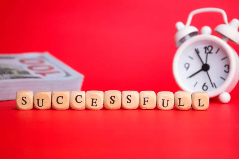 Clock and paper money with the word successful