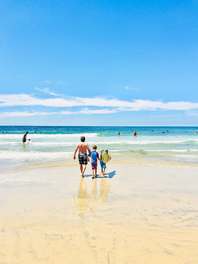 A family walking together outdoors, settling into a new country